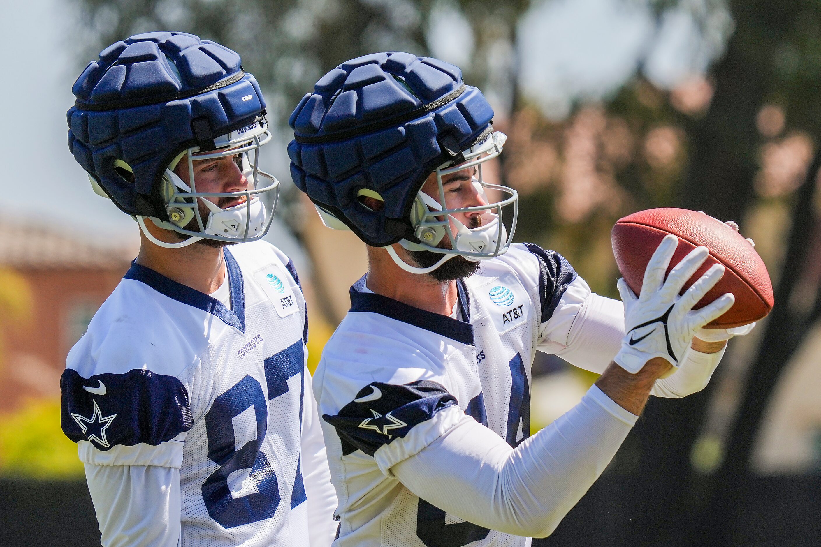 Dallas Cowboys tight end Sean McKeon (84) catches a ball as tight end Jake Ferguson (87)...