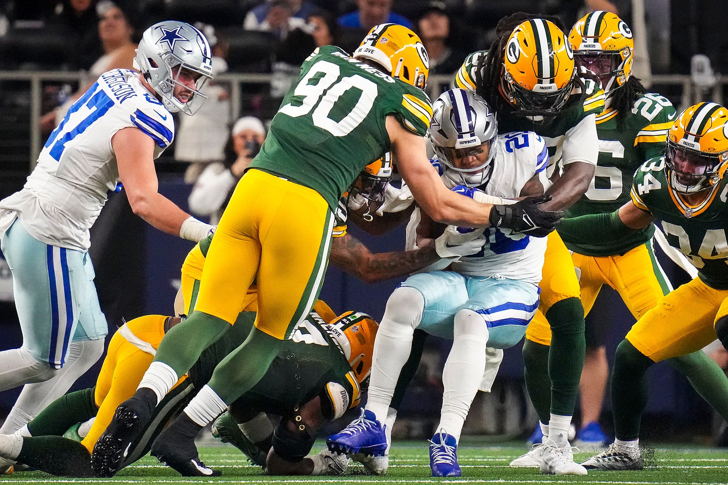 Dallas Cowboys running back Tony Pollard (20) is stuffed by Green Bay Packers linebacker...