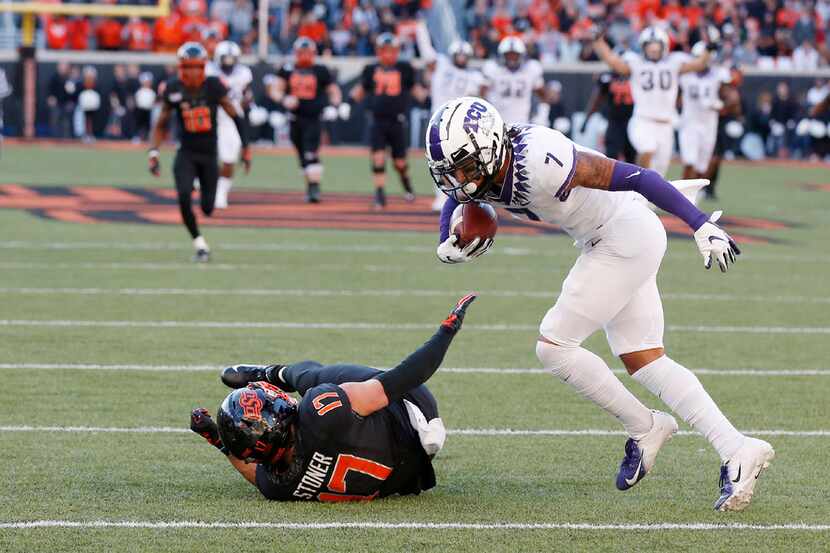 TCU safety Trevon Moehrig (7) comes down with the ball on an interception on a pass intended...