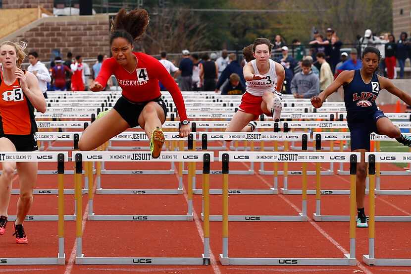 Carrollton Creekview's Sami Gonzales (2nd L) cruise to victory in the 100 meter  hurdles at...