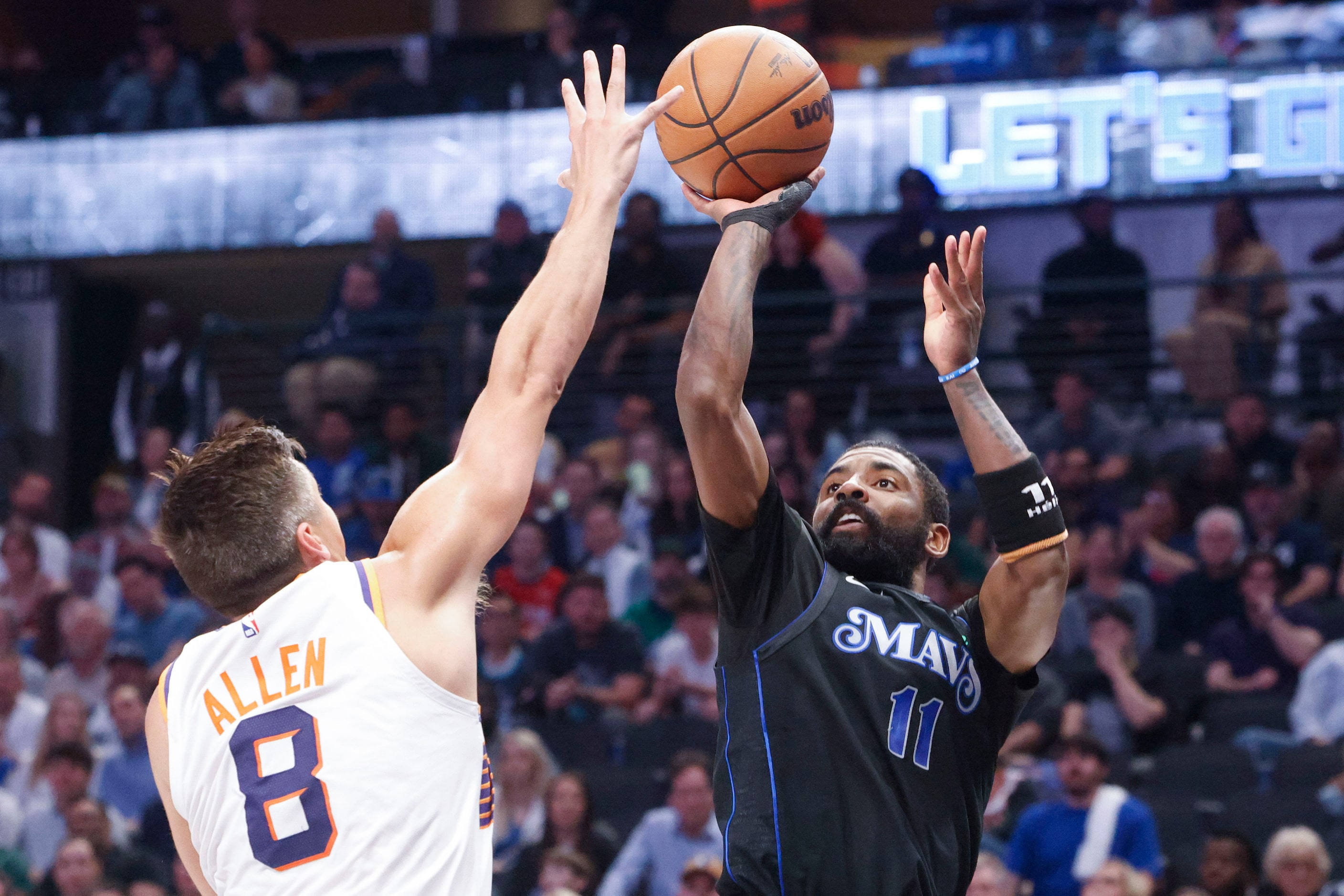 Phoenix Suns guard Grayson Allen (8) reaches to block as Dallas Mavericks guard Kyrie Irving...