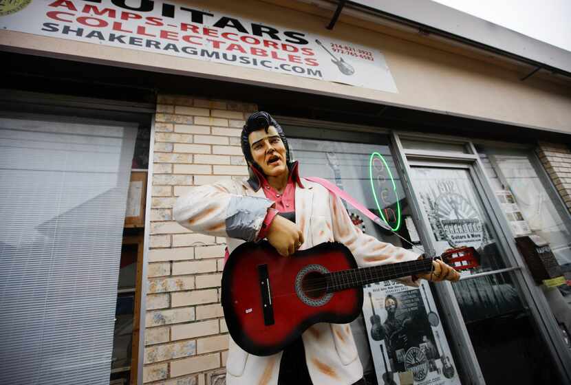 An Elvis statue stands outside Shake Rag when John Gasperik's inside.