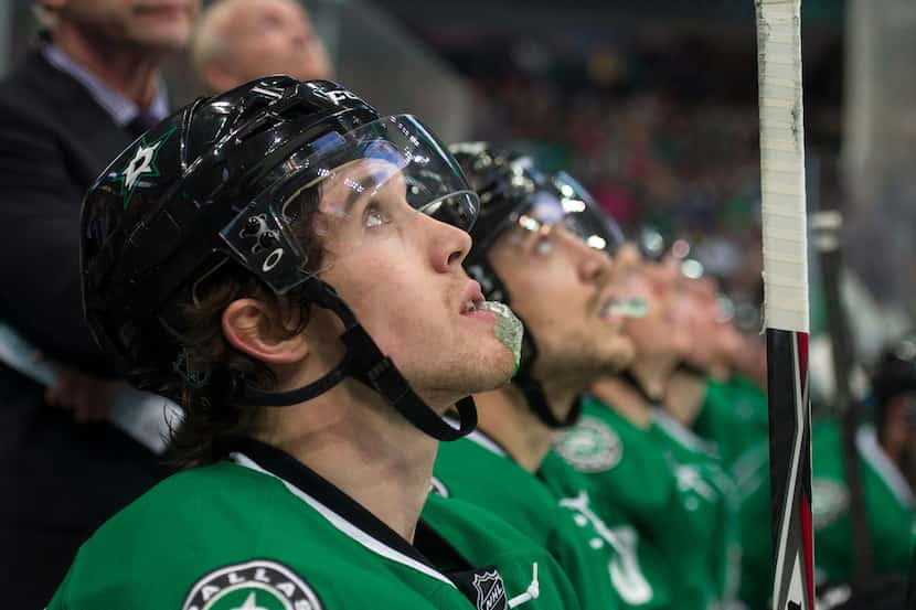 Mar 15, 2015; Dallas, TX, USA; Dallas Stars left wing Curtis McKenzie (11) and his teammates...