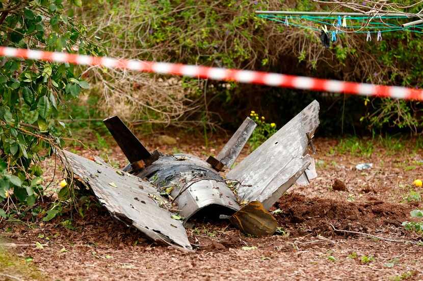 The remains of a missile that crashed in Alonei Abba, east of Haifa, lie on the ground in...