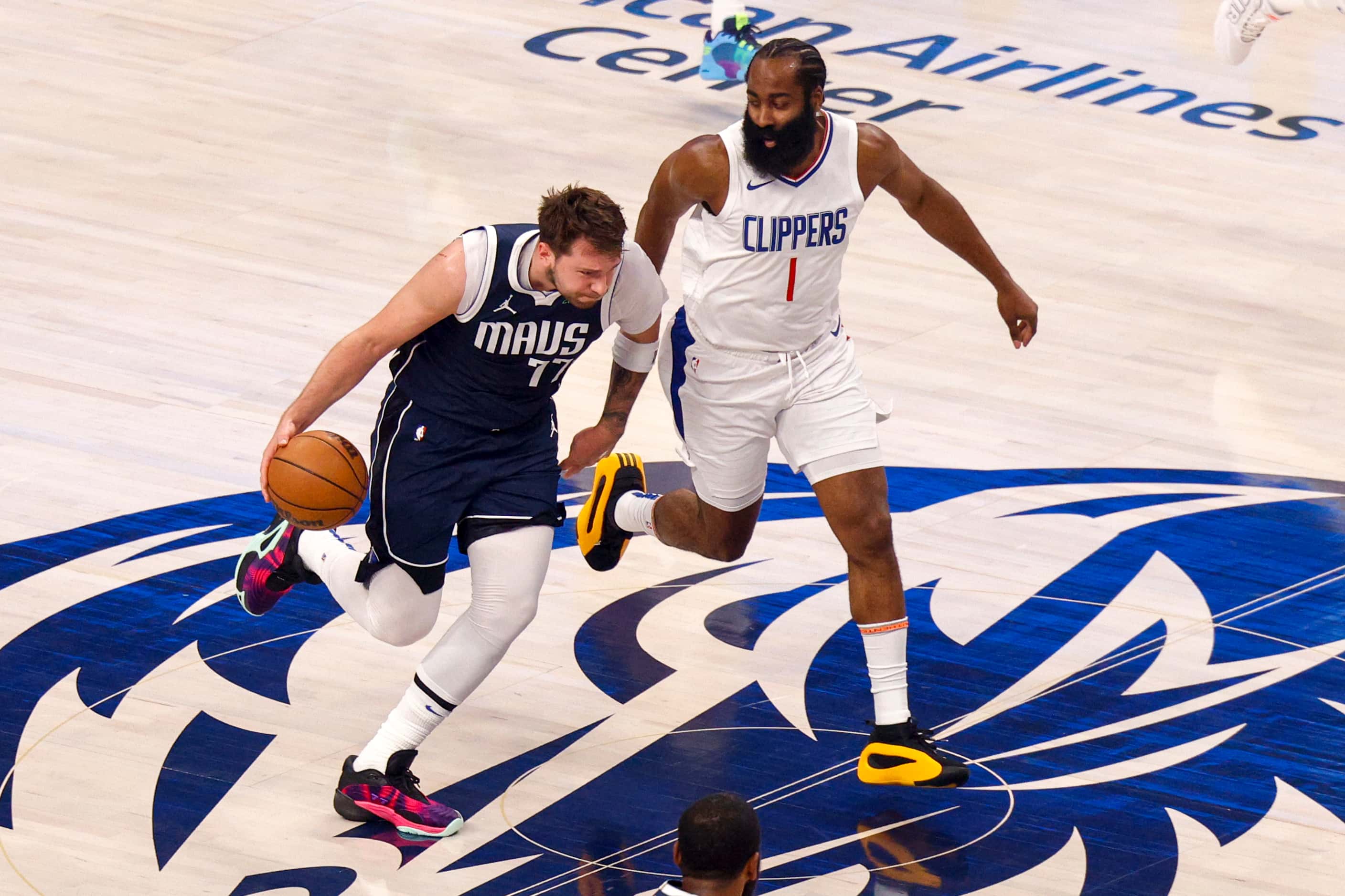 Dallas Mavericks guard Luka Doncic (77) dribbles up the court as LA Clippers guard James...