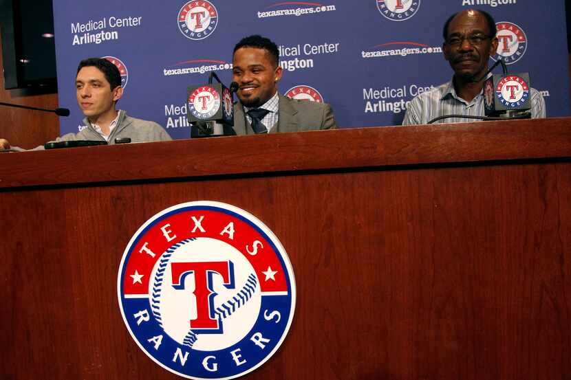 Texas Rangers GM Jon Daniels, left, and Manager Ron Washington, right, introduce Prince...