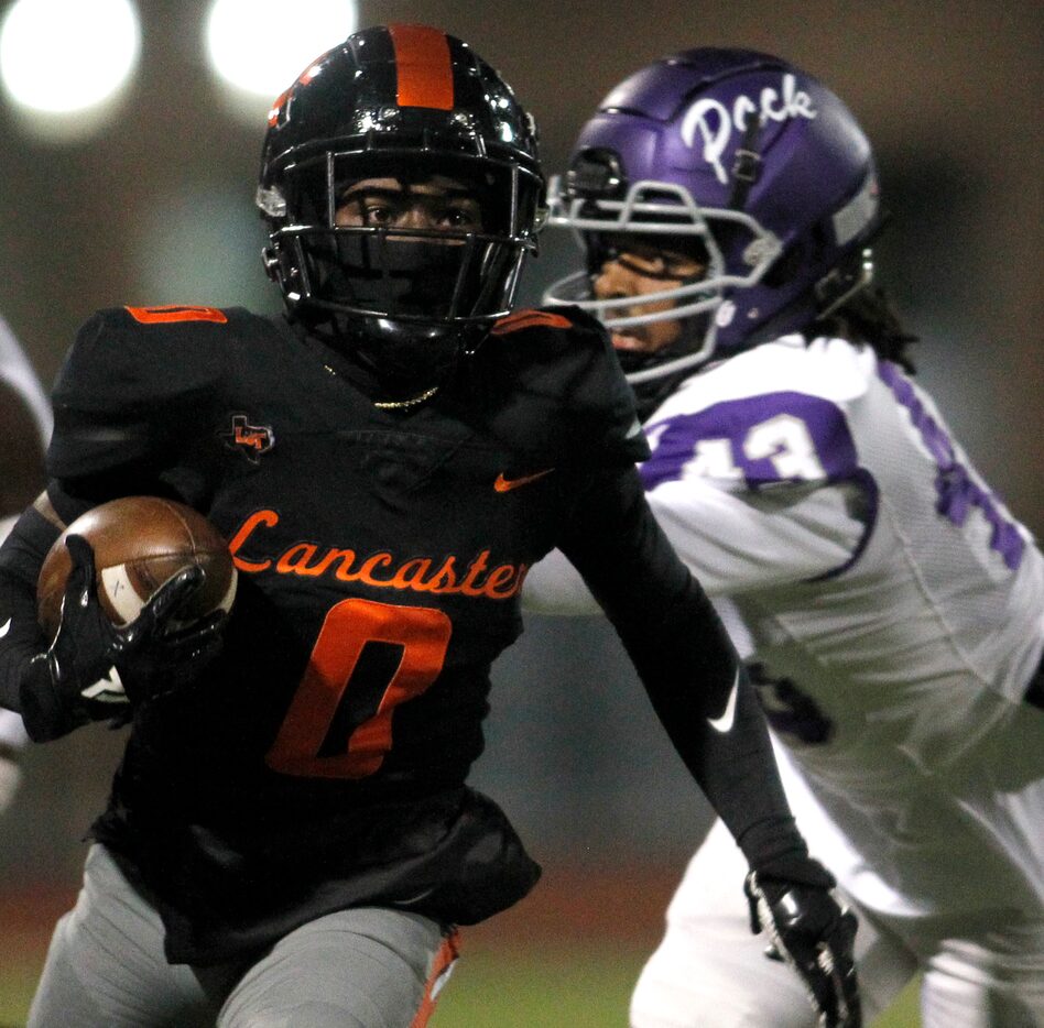 Lancaster receiver Ti'Erick Martin (0) races for a first down as he is pursued defensively...