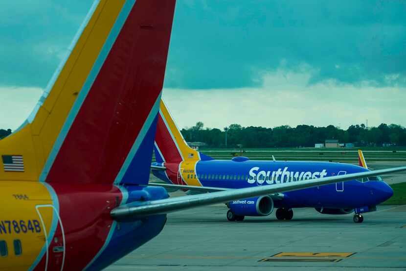 A Southwest Airlines plane taxis to the gate at Hobby Airport in Houston on Friday, March...