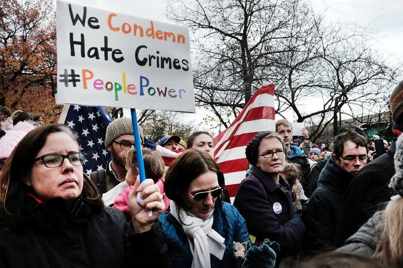 NEW YORK, NY - NOVEMBER 20:  People participate in an anti-hate rally at a Brooklyn park...