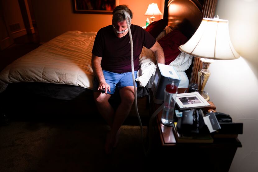 In a new nighttime ritual, after donning an oxygen mask, Michael Hoffman checks his blood...