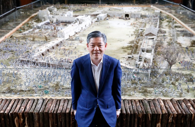 Karl Chiao, executive director of Dallas Historical Society, stands before the Alamo battle...