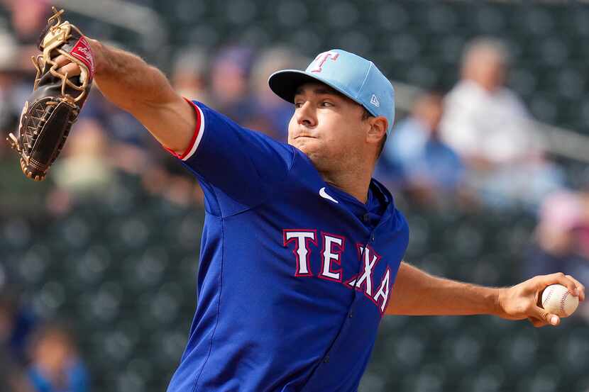 Texas Rangers pitcher Brock Burke delivers during the sixth inning of a spring training game...