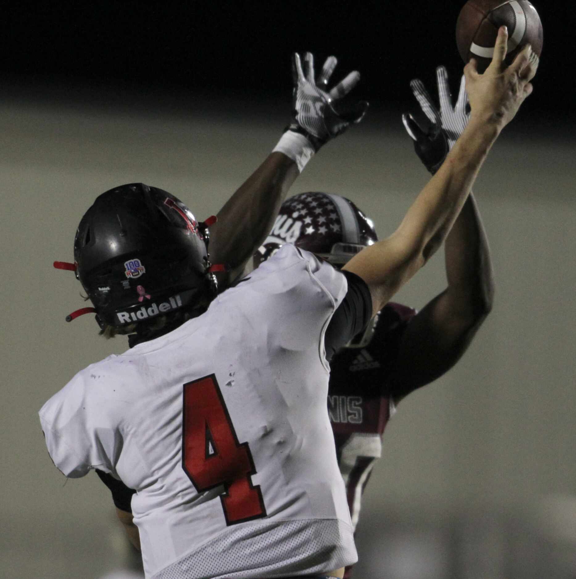 Frisco Liberty quarterback Will Glatch (4) gets off a pass under pressure from Ennis...
