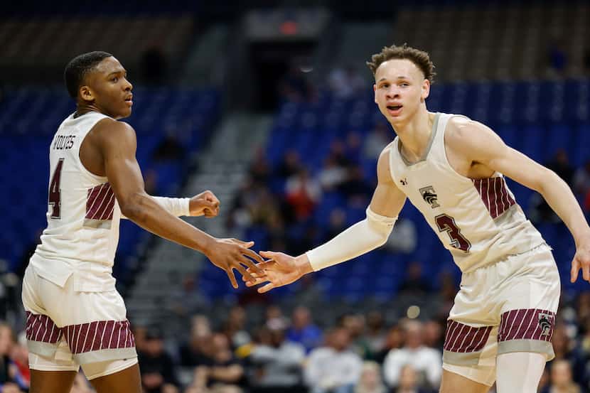 Mansfield Timberview guards Donovan O'Day and Chendall Weaver (right) high-five each other...