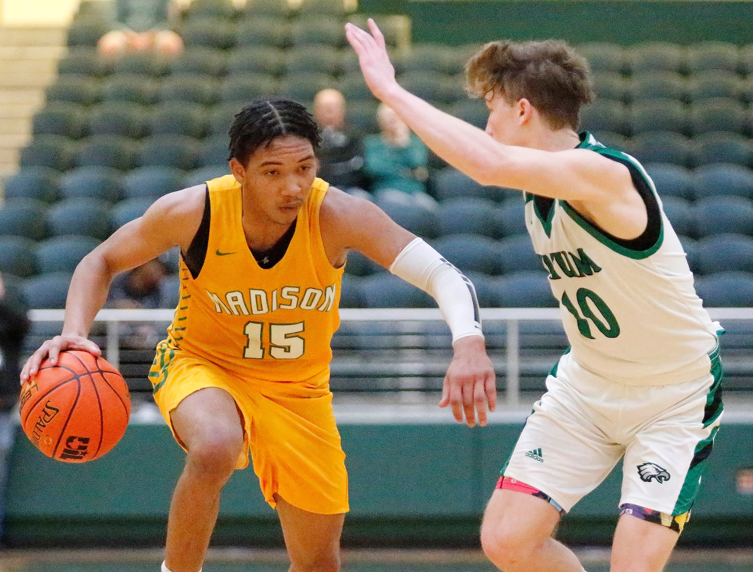 Madison forward Larell Wright (15) gets by Tatum guard Ty Bridges (10) during the second...