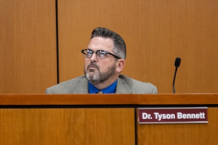  Superintendent Tyson Bennett sits as board members vote in support of opening a third-party...