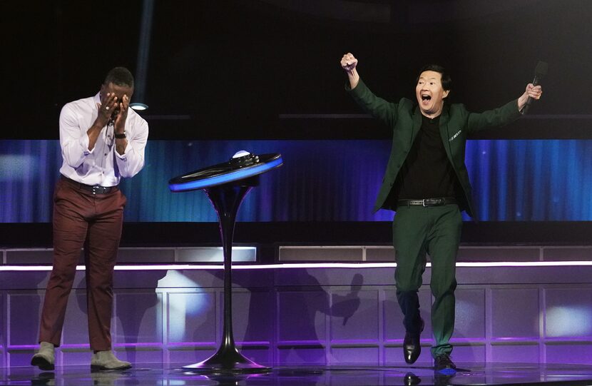 Frank Adams exults and "I Can See Your Voice" host Ken Jeong celebrates after Adams'...