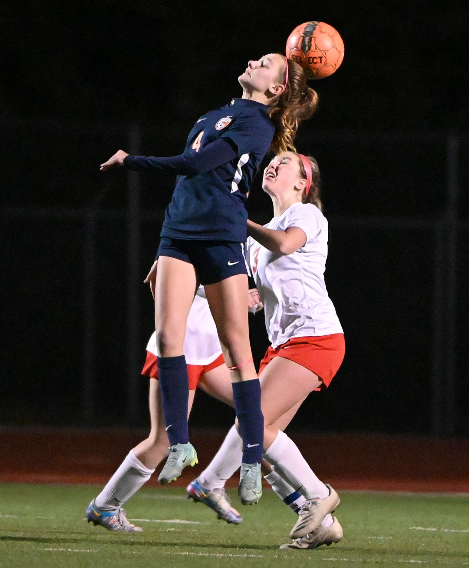 Frisco Wakeland’s Lauren Vacek (4) gets to a header over Frisco Centennial’s Ava Szczygiel...