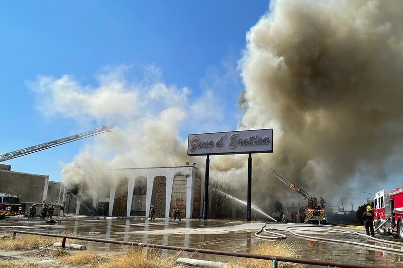 About 50 to 60 Dallas firefighters are battling a blaze at a vacant two-story building in...