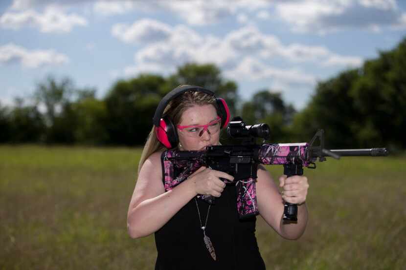 Daley Laurel of Blue Ridge, Texas shoots at a target with her Olympic Arms AR-15 with...