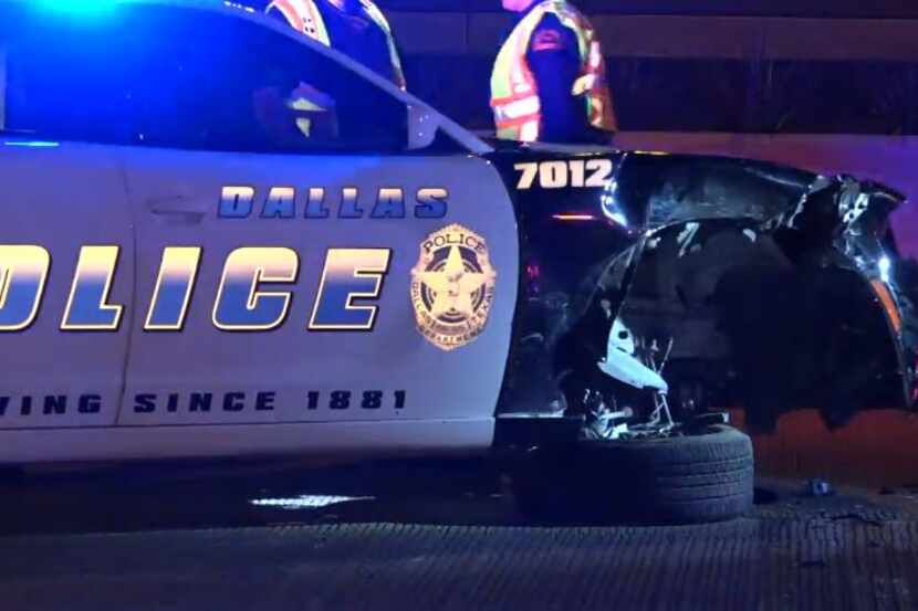 A Dallas police squad car was damaged when a passing Fiat 500 slammed into its front...