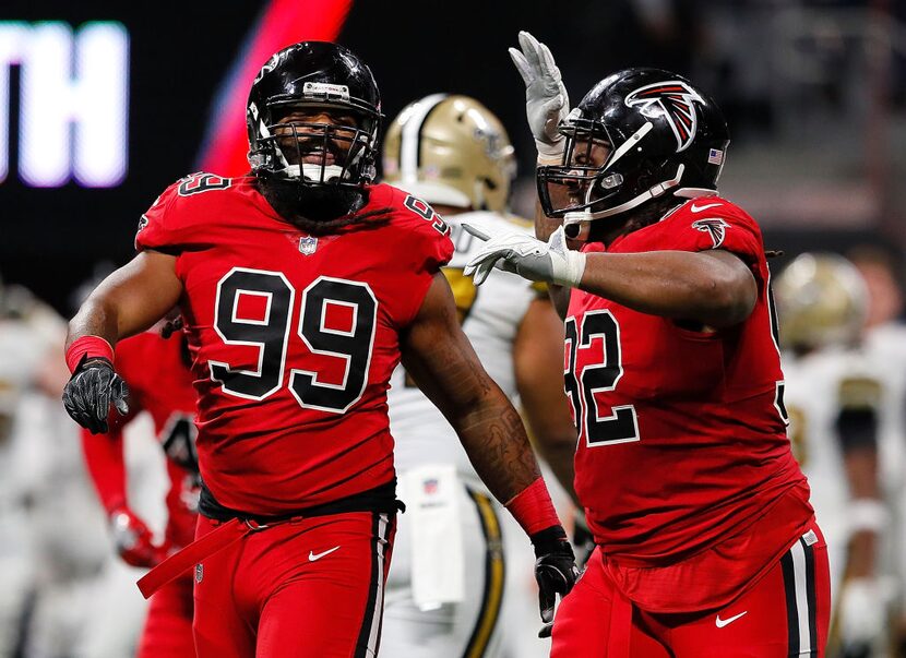 ATLANTA, GA - DECEMBER 07:  Adrian Clayborn #99 of the Atlanta Falcons reacts with Dontari...