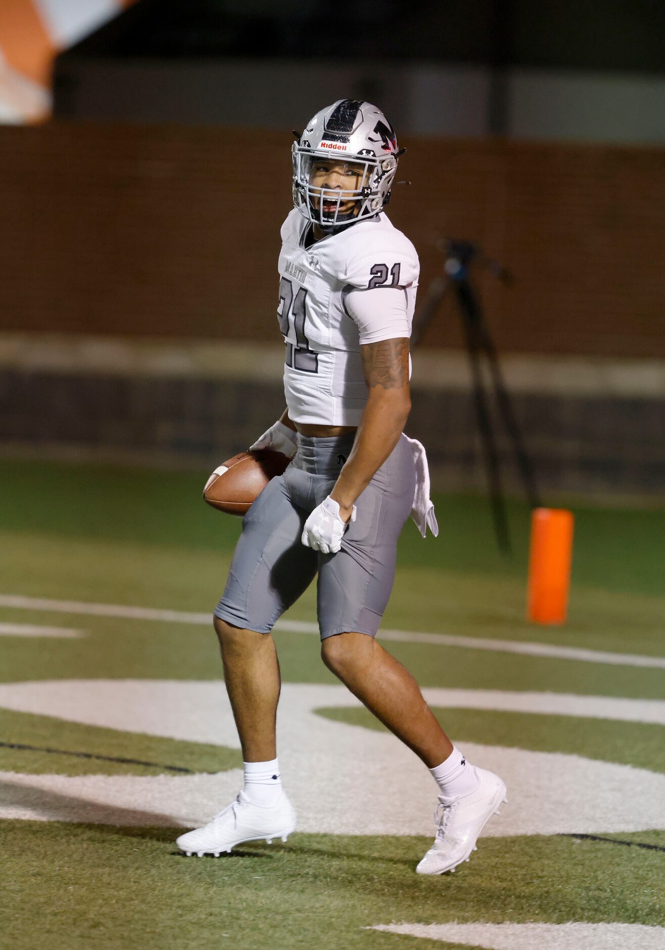 Arlington Martin linebacker Trevell Johnson (21) celebrates his fumble recovery touchdown...