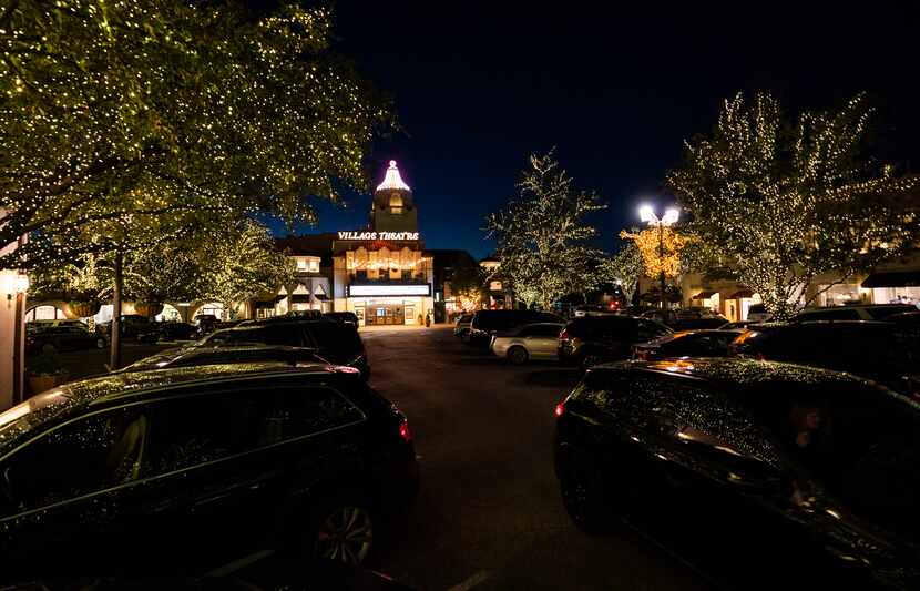 A crew spends 50 days stringing the white lights around trees in Highland Park Village. If...