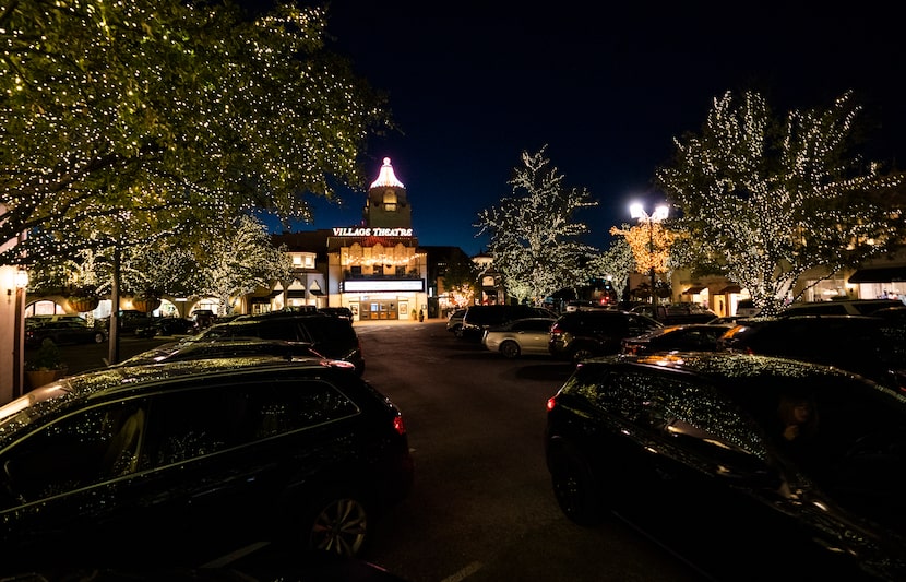 A crew spends 50 days stringing the white lights around trees in Highland Park Village. If...