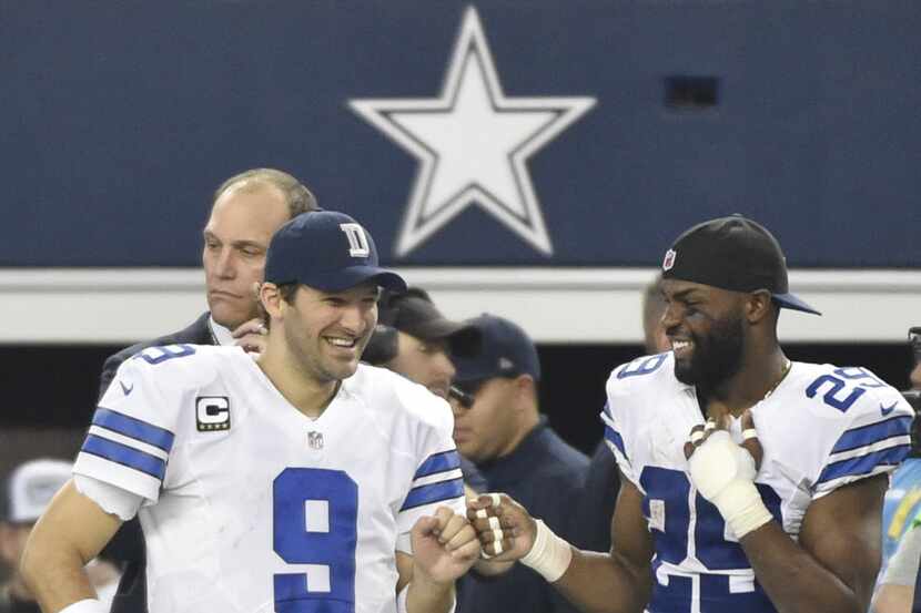 Dallas Cowboys quarterback Tony Romo (9) and Dallas Cowboys running back DeMarco Murray (29)...