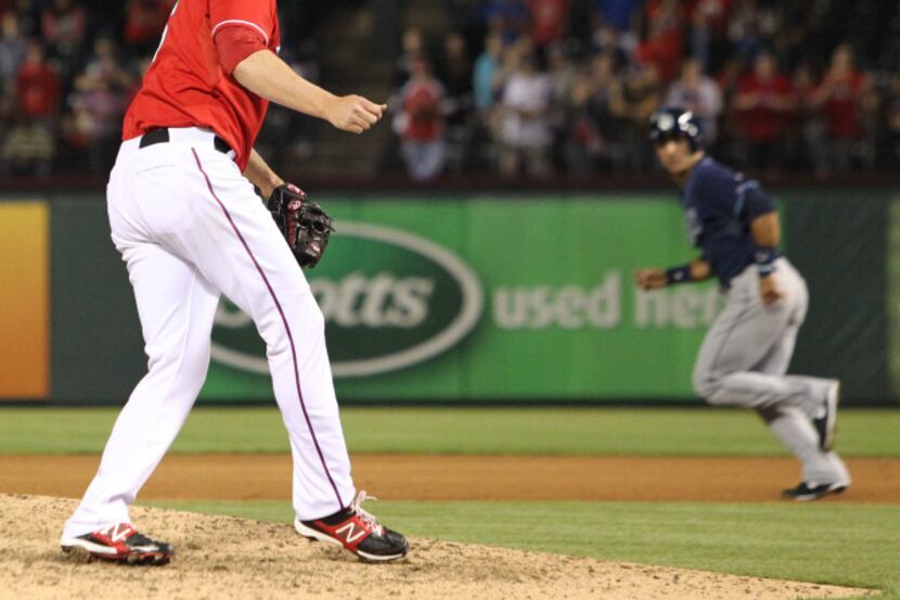 Texas closer watches as the umpires call Ben Zobrist out to end the game in Texas' 5-4 win...