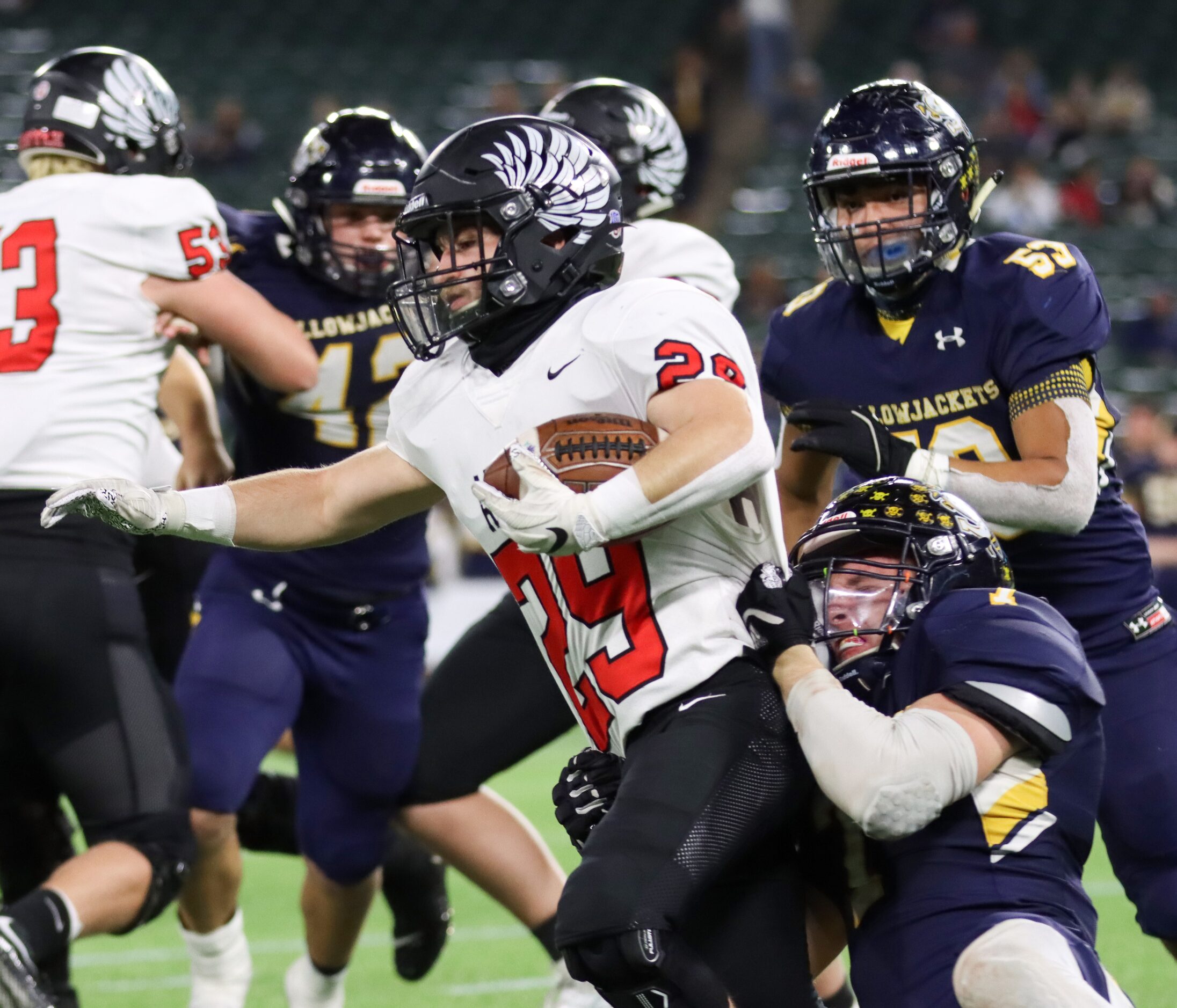 Stephenville linebacker Colton Accomazzo (7) tackles Argyle running back Braden Baker (29)...