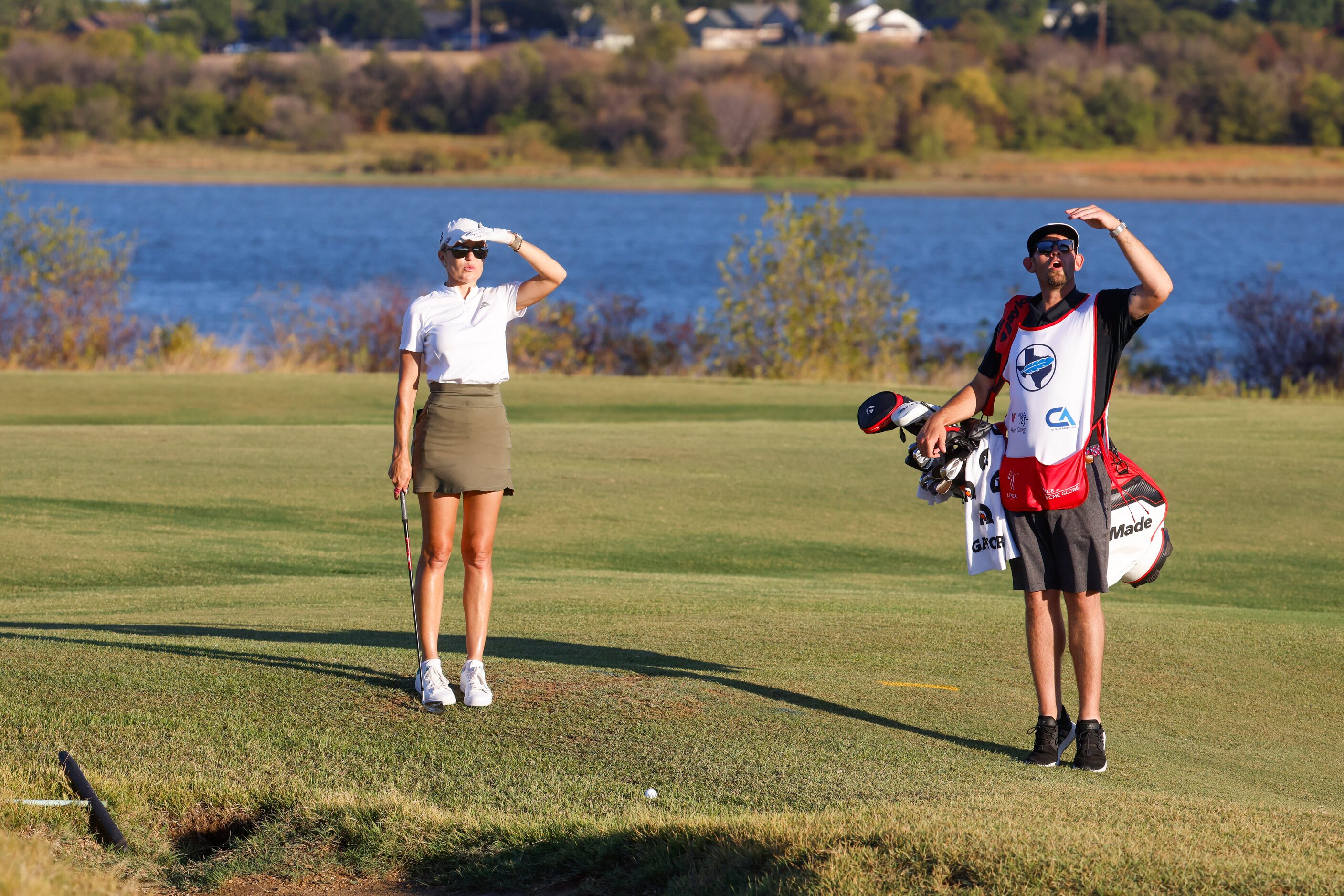 Natalie Gulbis of United States measures before hitting on the sixth fairway during the...