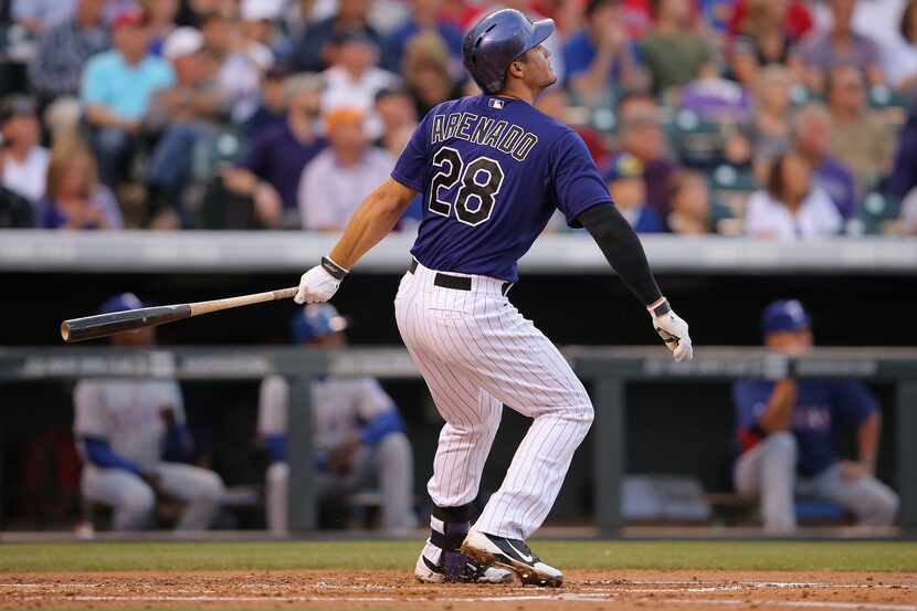 DENVER, CO - MAY 05:  Nolan Arenado #28 of the Colorado Rockies watches his two run home run...