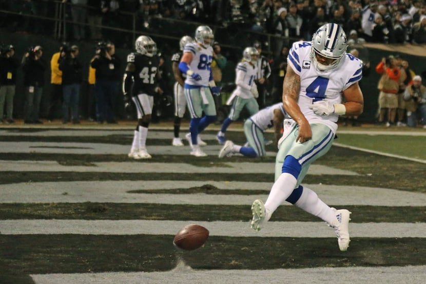 Dallas Cowboys quarterback Dak Prescott (4) spikes the ball after scoring a third-quarter...