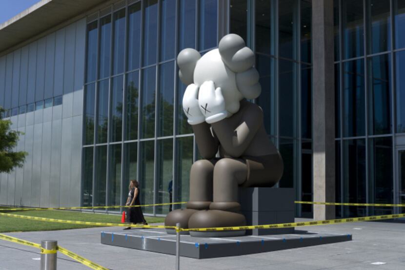 "Companion (Passing Through)" by the artist KAWS has turned lots of heads at the Modern Art...