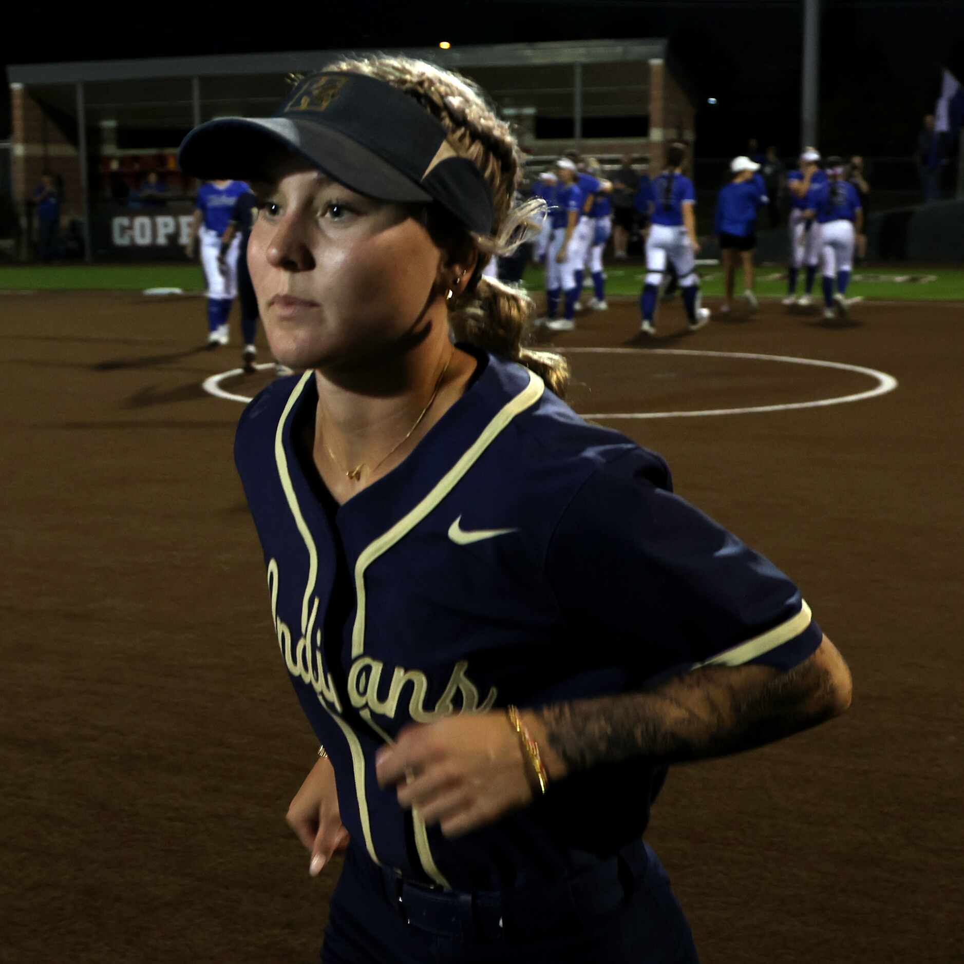 Keller's Maggie Crow (5) runs to celebrate with teammates following their 10-0 victory over...