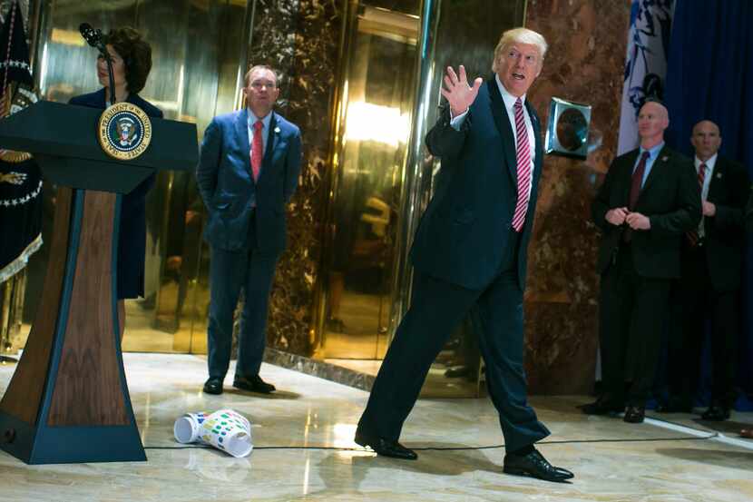 President Donald Trump walks off after a news conference in the lobby of Trump Tower in...