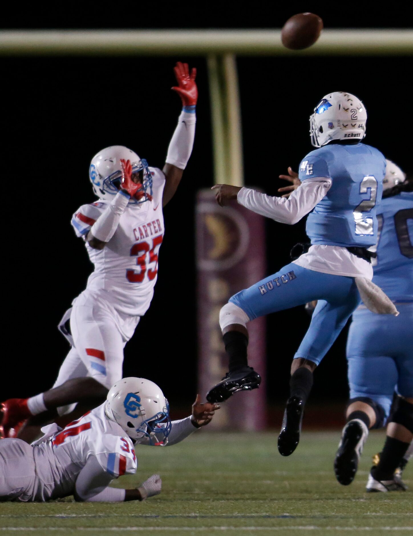 Despite heavy pressure from Dallas Carter linebacker Janari Hyder (35) and defensive lineman...