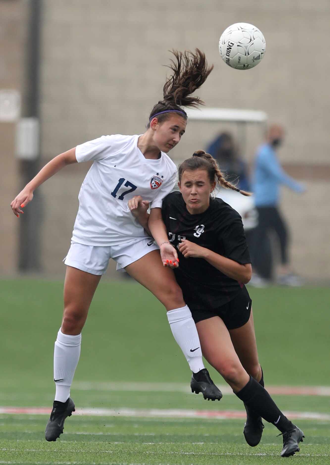 Wakeland's Lillian Wallace (17) and Dripping Springs' Chloe Fredenburg (22) go up  for the...