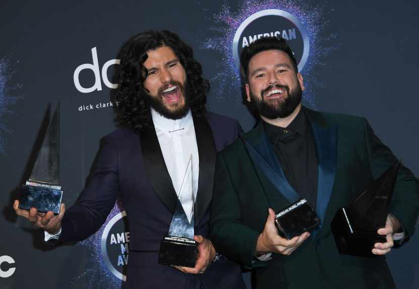 Dan Smyers and Shay Mooney of the musical duo Dan + Shay posed with their awards in the...