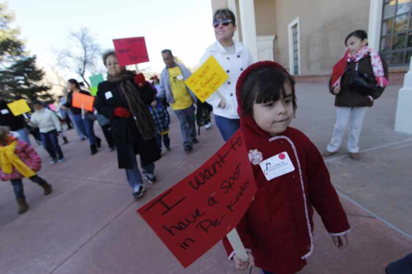 Pre-kindergarten studentand her family join in a rally in Sante Fe, N.M., in support of...