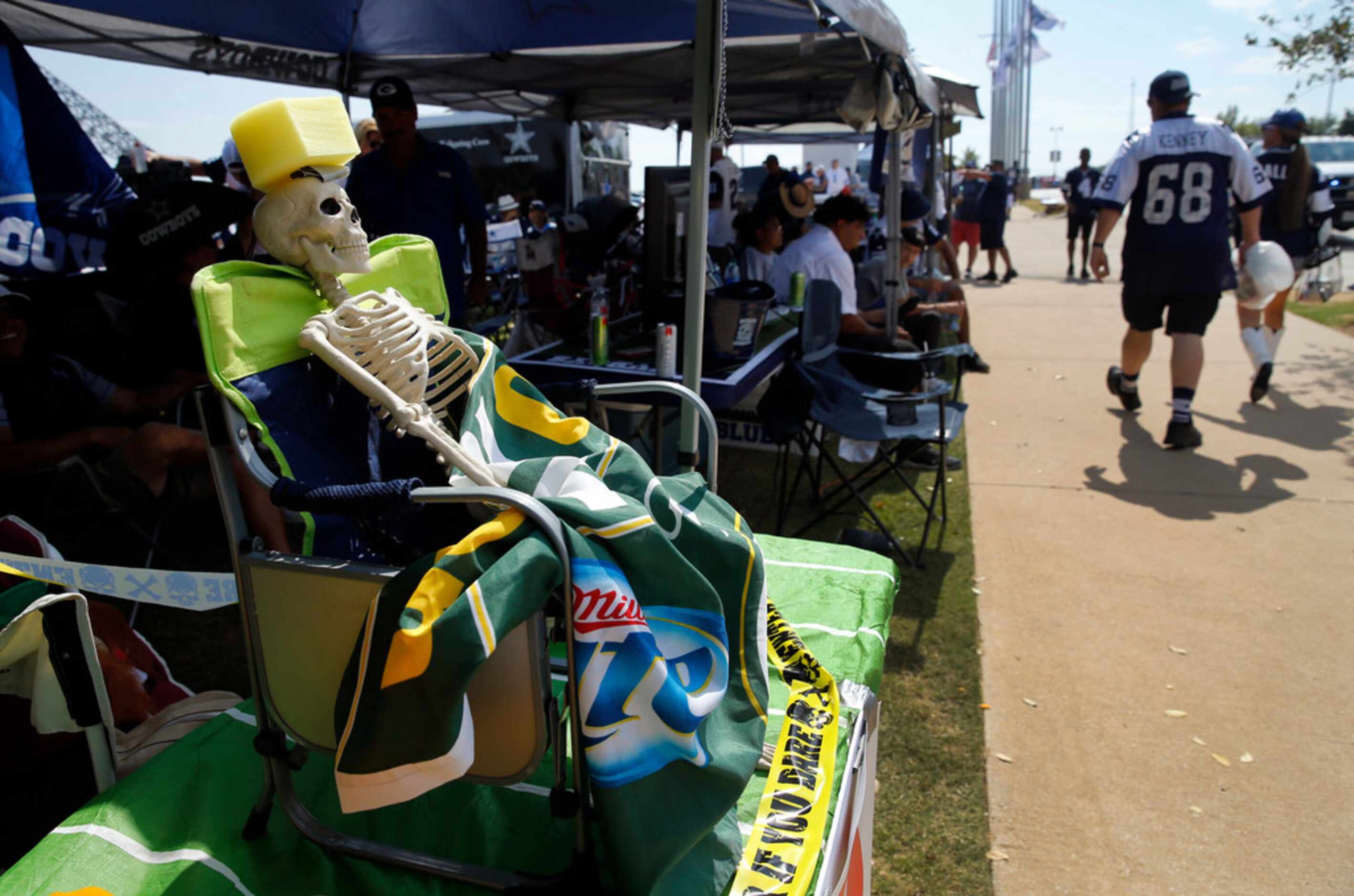 Dallas Cowboys fans display a Green Bay Packers skeleton during a tailgate party before the...