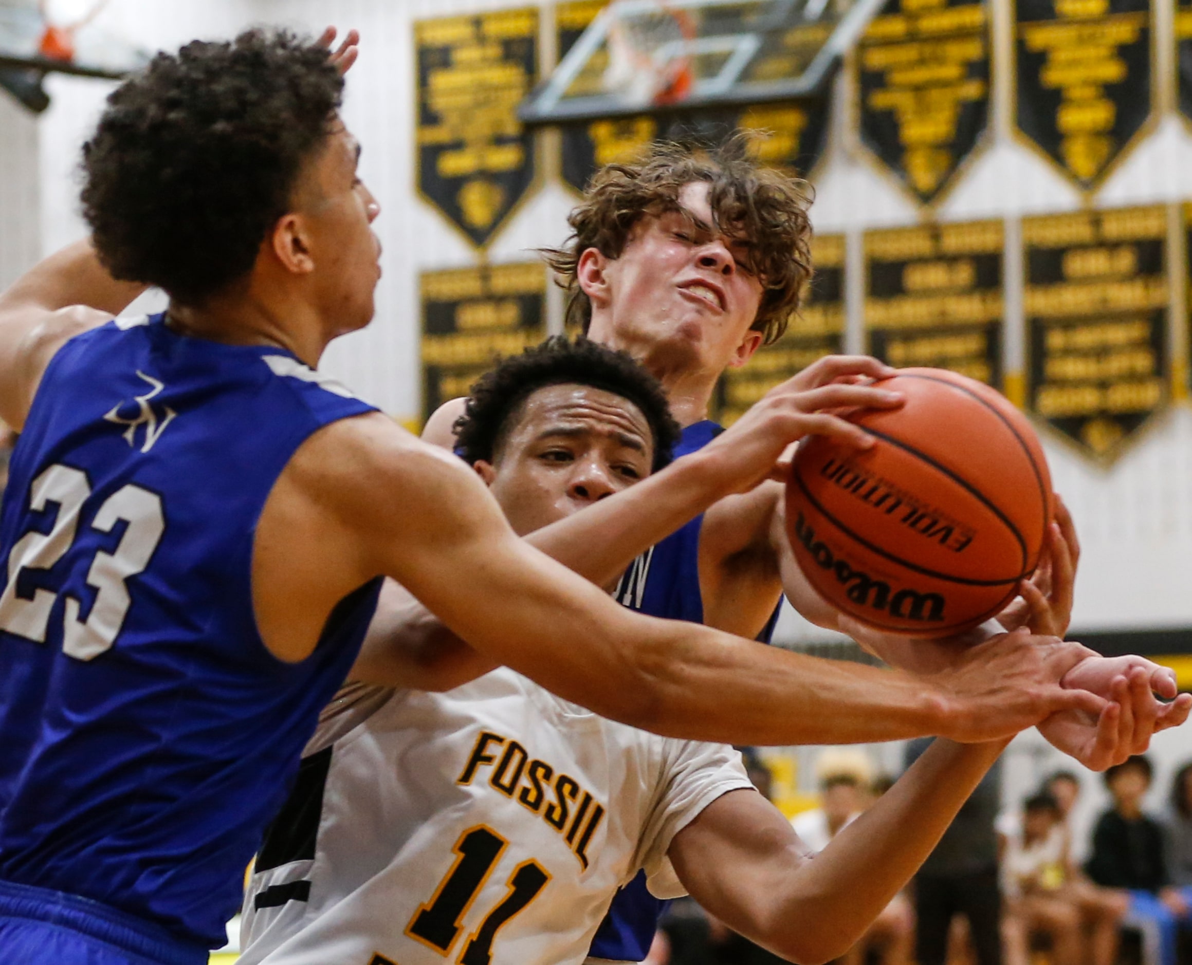 Fossil Ridge High School Kwamir McBean (11) holds onto the ball while Byron Nelson High...