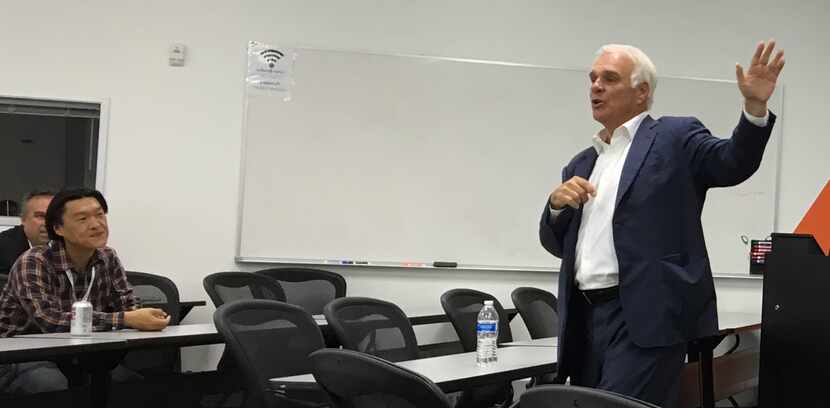 Dallas Stars CEO Jim Lites talks with entrepreneurs as part of a business accelerator...