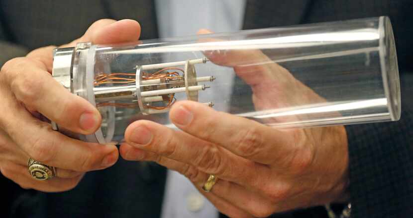 University of North Texas chemistry professor Guido Verbeck holds the sensor of a...