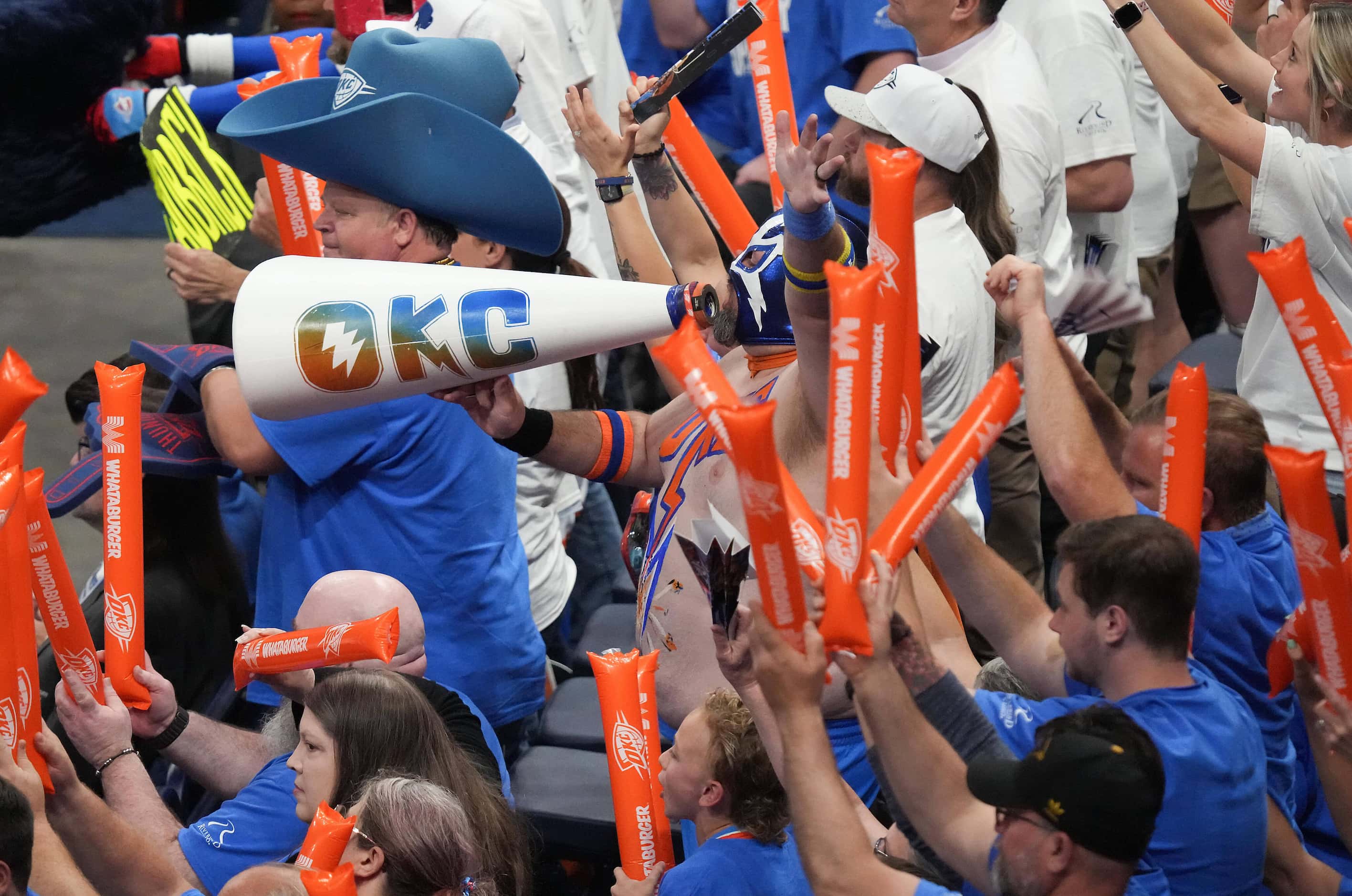 Oklahoma City Thunder fans try to distract a free throw by Dallas Mavericks guard Luka...