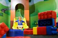 Beckham Sharp, 2, comes out the slide on, Saturday, June 1, 2024, at LEGOLAND Discovery...