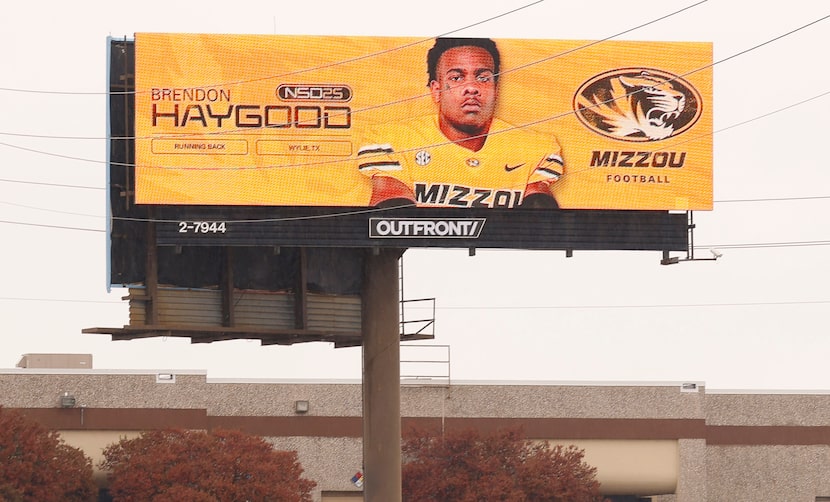 Sachse running back Brendon Haygood appears on a billboard along westbound Interstate 635...