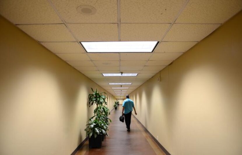 
Michael Gonzales walks down an underground tunnel in the Bank Tower.
 
